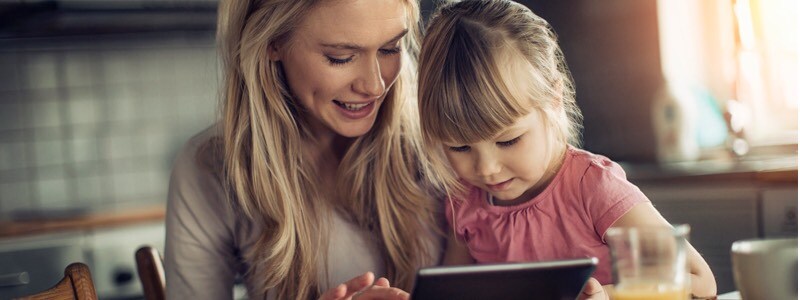 Mother and daughter using tablet together